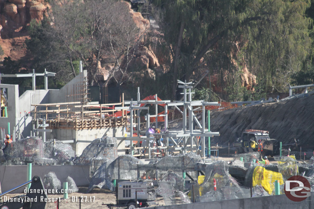 The rock work continues to spread around the Rivers of America.