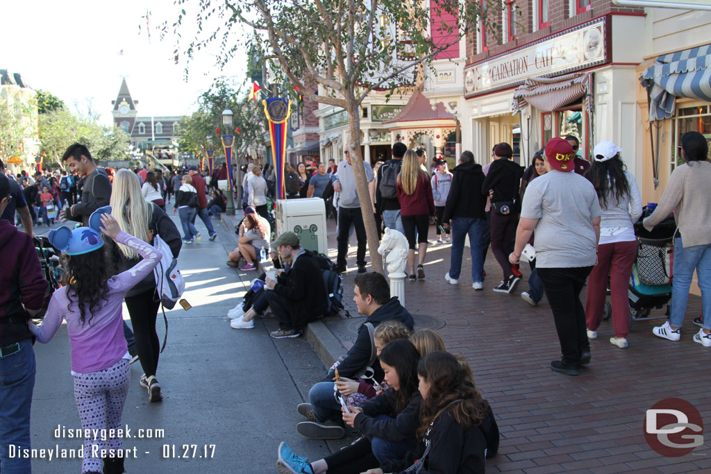 It is 3pm and guests are claiming curb seats for the Main Street Electrical Parade.. which starts at 8:30pm.  There are no day time parades going on right now.