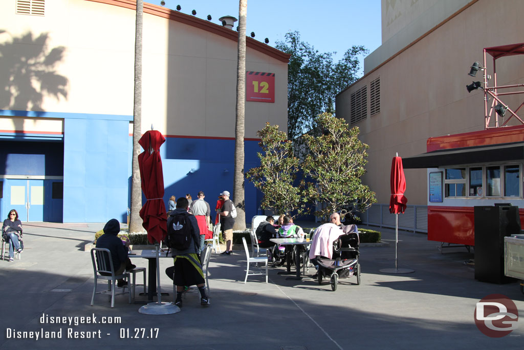 Guests hanging out at the tables near stage 12.