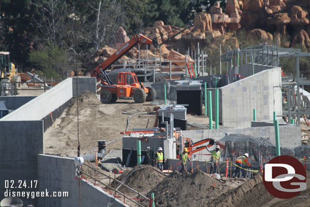 Dirt is being put on the roof of the marina structure.  Looks like quite a ways to go based on the black and the pipe/drain in the middle.