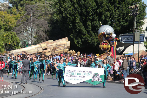 A high school band marching through the park this afternoon (there is no day time parade right now).