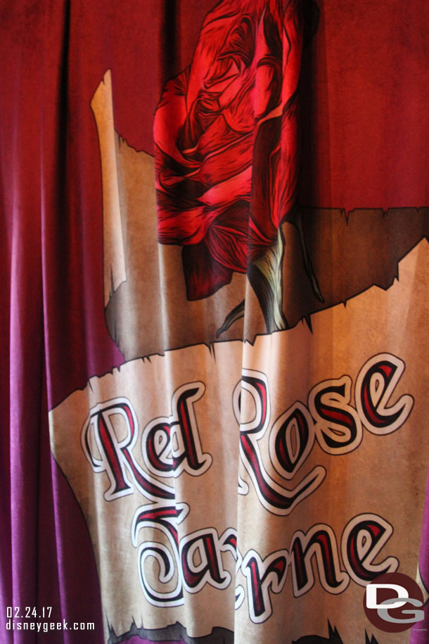 The other side of the curtain by the entrance features the name/logo.