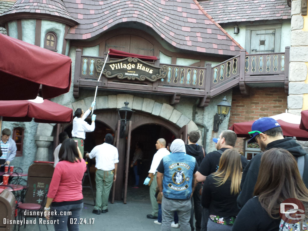 Something happened with the sign and cast members were working on it.