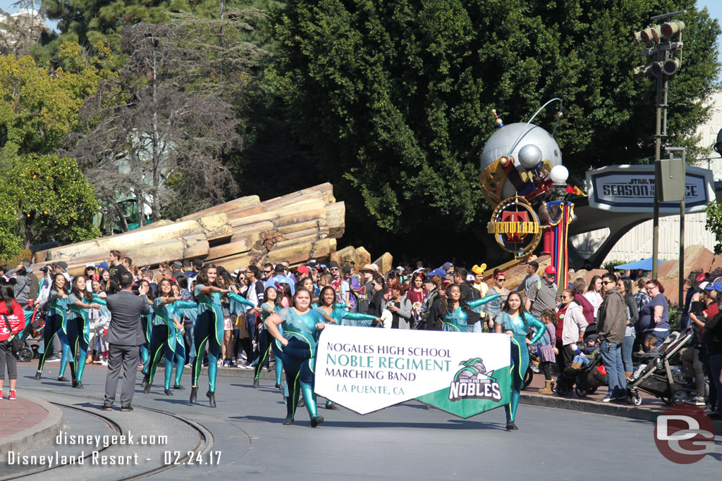 A high school band marching through the park this afternoon (there is no day time parade right now).