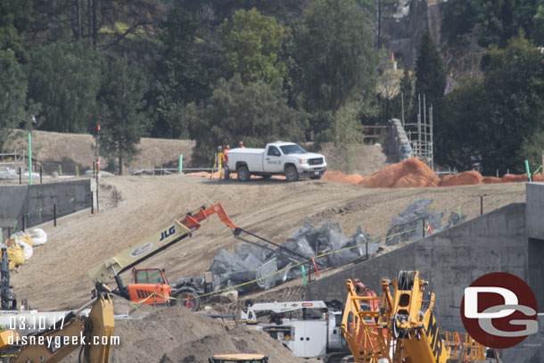 More wire mesh waiting to be installed along the Rivers of America to form rocks.