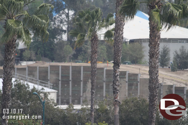 In the distance you can see the top of some vents on the far berm beyond the retaining wall.  That is the roof of the new train tunnel.