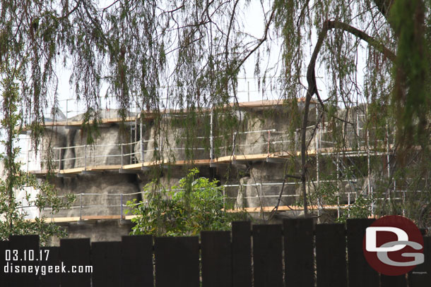 the first coating of concrete has been applied to the new rock wall on the left.