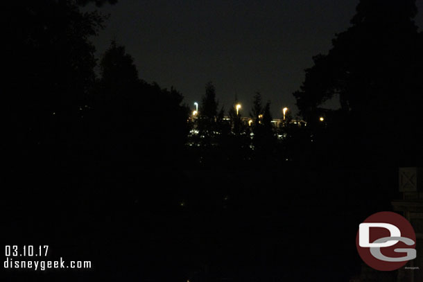 Hard to see.. but this is the view from the Rivers of America.  the new trees currently block a good portion of the parking structure lights.  Once they grow in it will be better (also not sure if all are in place and if any buildings will help too.