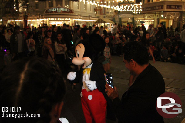 I thought this was great. Mickey, Minnie, and Pluto were working the crowd line. They were high fouring (fiving) guests and waving.