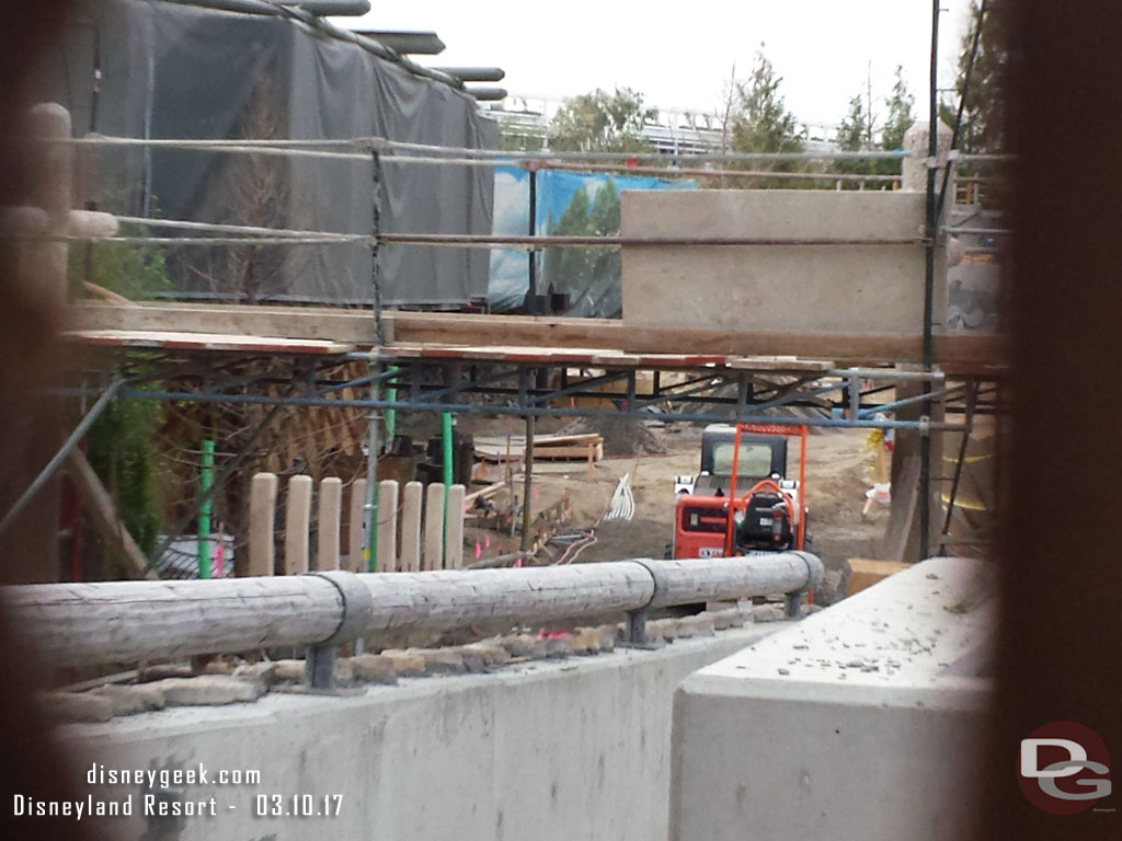 Looking through the fence at the walkway.  Scaffolding up as they work on something that will go over part of it.