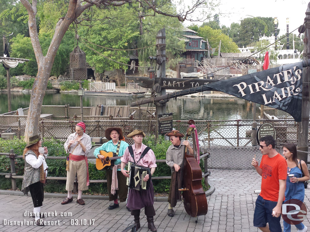 The Bootstrappers performing near the Rivers of America.