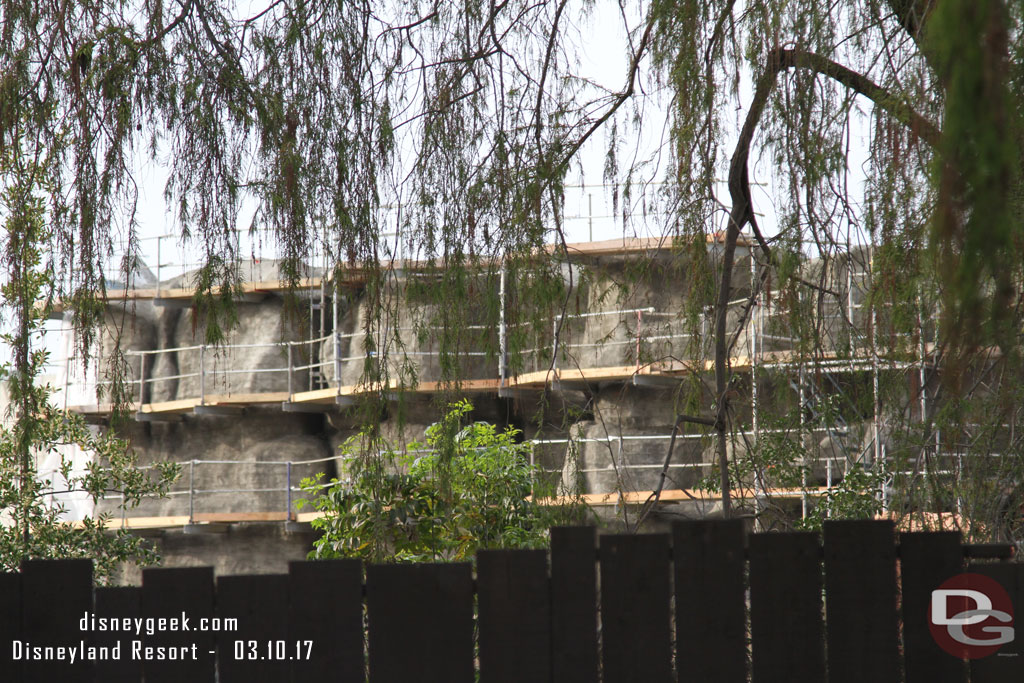 the first coating of concrete has been applied to the new rock wall on the left.