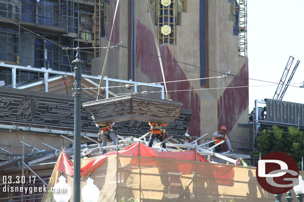 The corner piece being lowered into position.