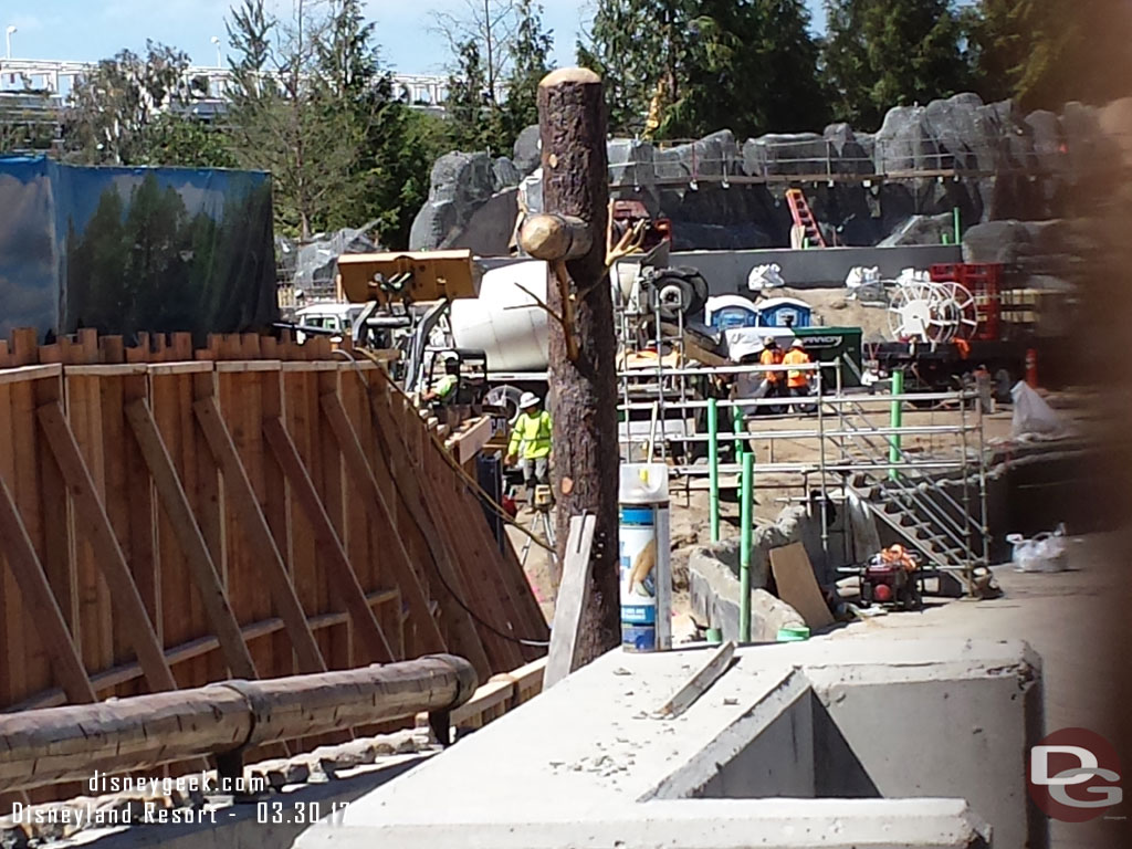 A new fence/wall is up along a portion of the new walkway.