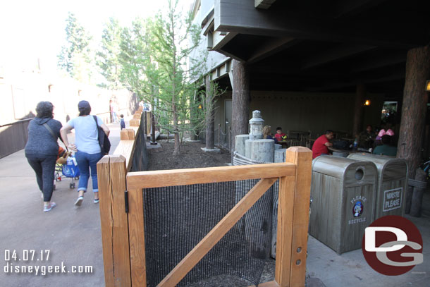 Looking up the ramp.  Some trees in between the dining area and walkway.