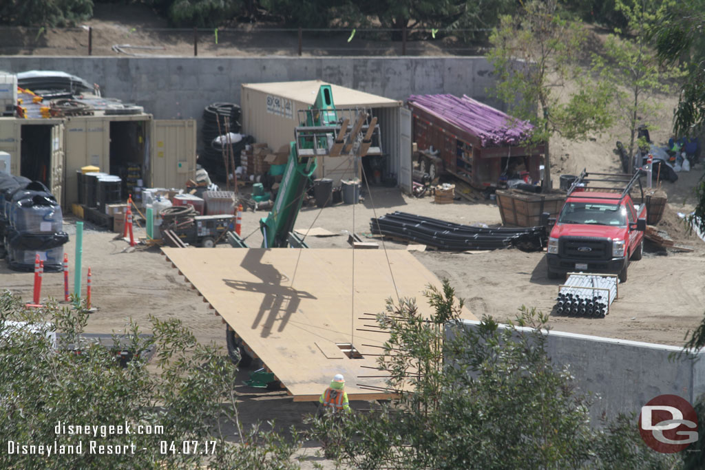 A team moving a large wall form around.