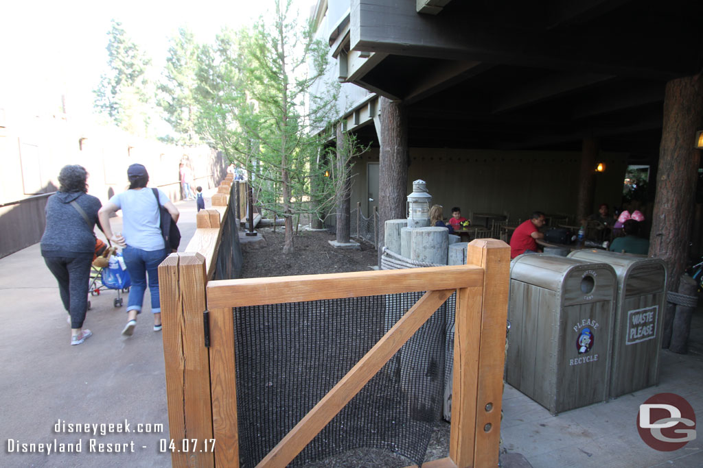 Looking up the ramp.  Some trees in between the dining area and walkway.