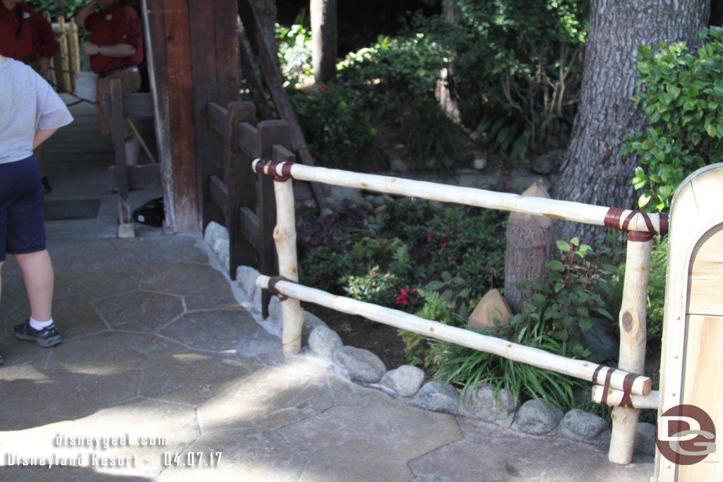 The rail and border have been replaced where the temporary walkway connected near the entrance to Winnie the Pooh