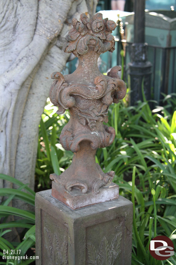 In some of the planters of New Orleans Square some new statues have appeared over top of utility plates.