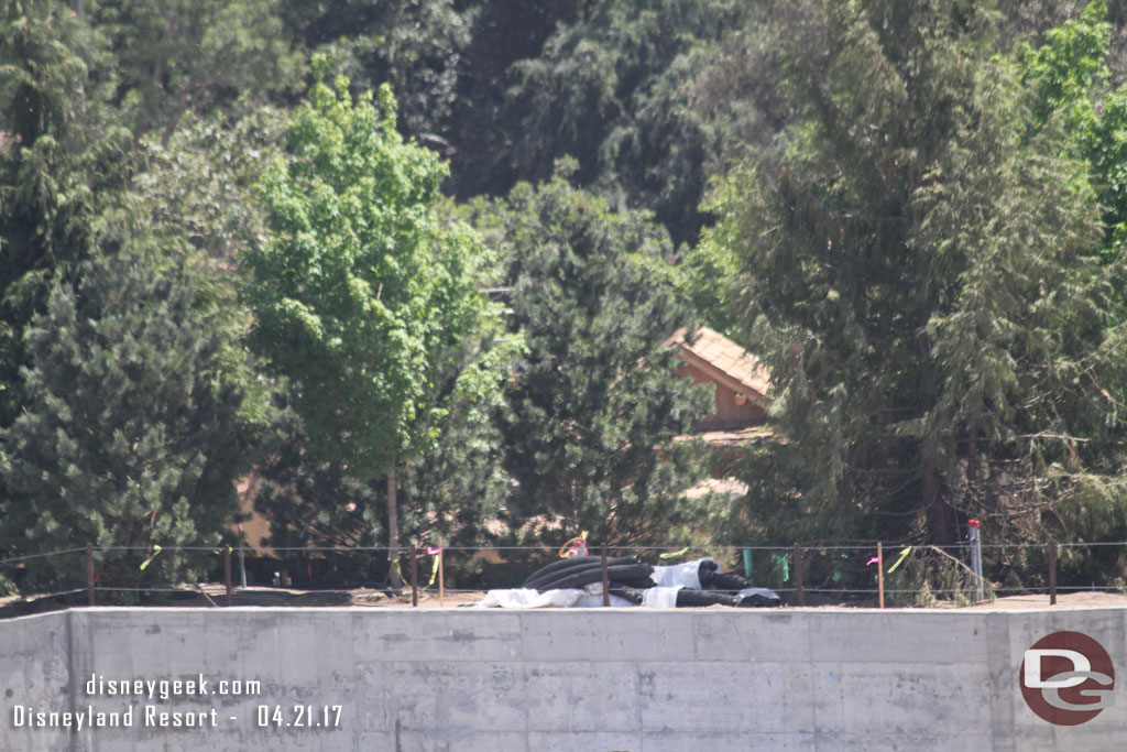 You can just barely make out the top of the cabin still through the trees.