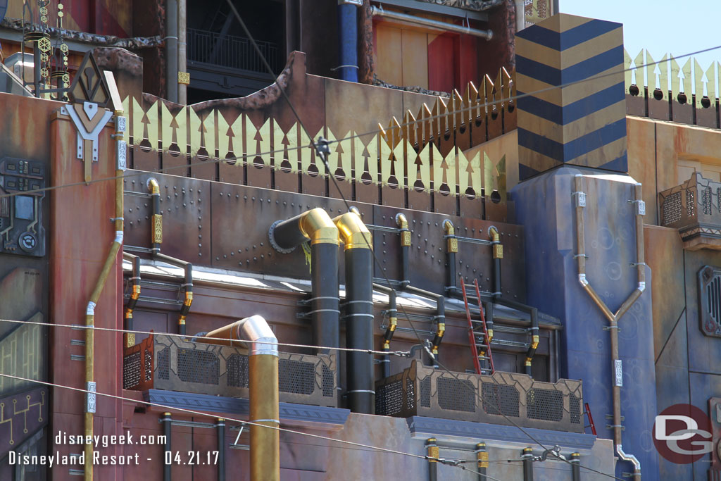 Some ladders and workers seen around the building.