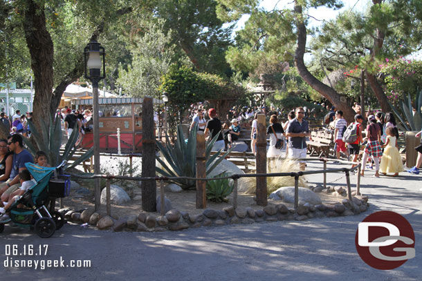 Three posts in Frontierland.  Best guess is they are for new directional signage.