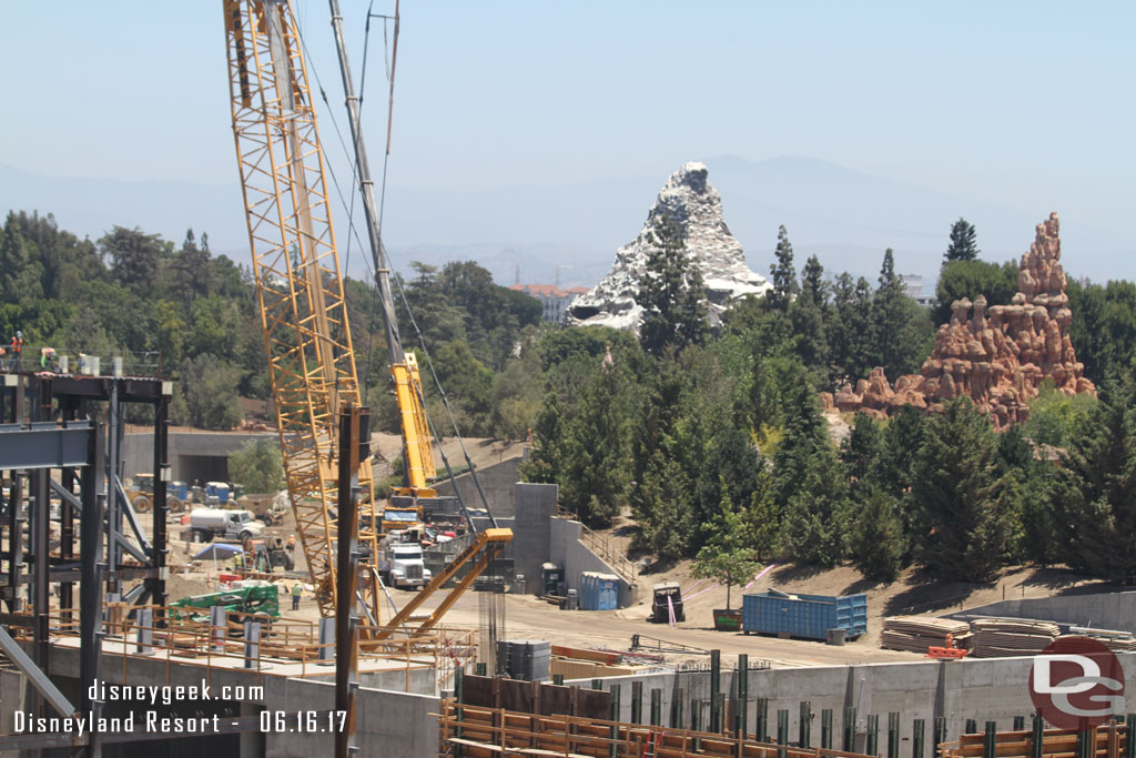 Work continues near the entrance tunnels.  They were lifting rocks over the berm for installation.