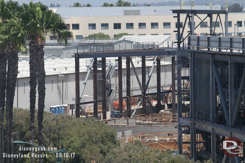 The steel is starting to surround the circular concrete structures for the Millennium Falcon building.
