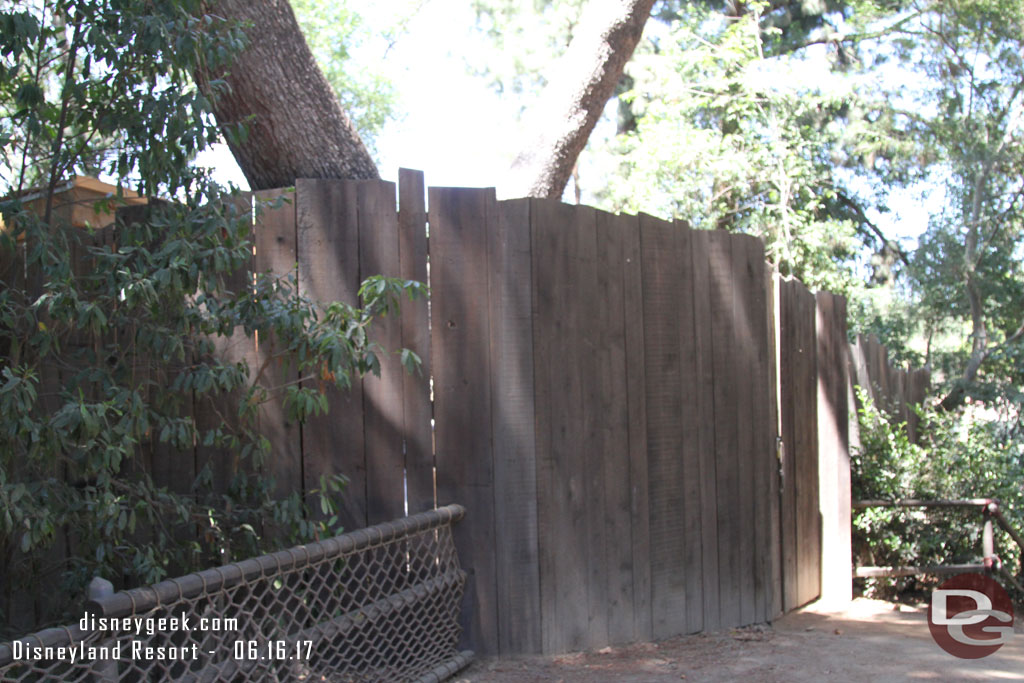 The fence leading to the far north of the island.  A new structure is being built behind it.  