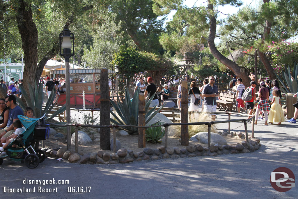 Three posts in Frontierland.  Best guess is they are for new directional signage.