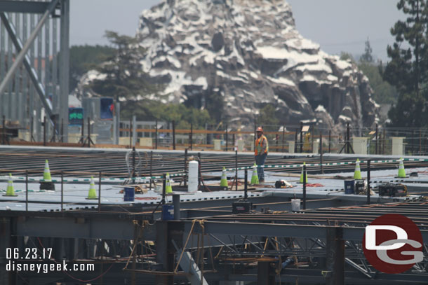 To the left roof panels continue to be installed.