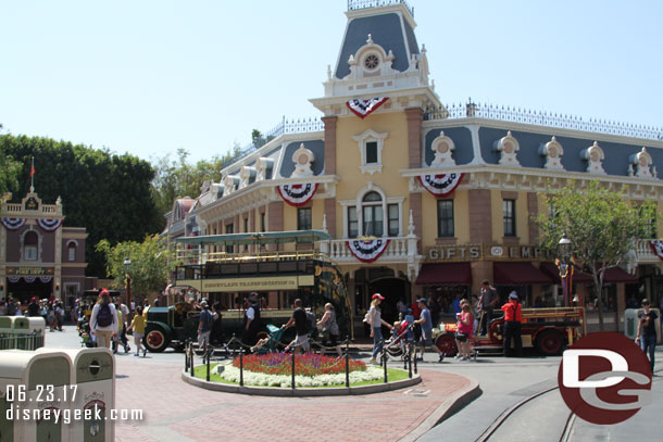 A traffic jam on Main Street too as a car, omnibus and firetruck all wait to head backstage.