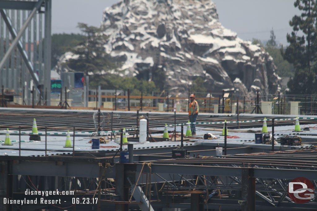 To the left roof panels continue to be installed.