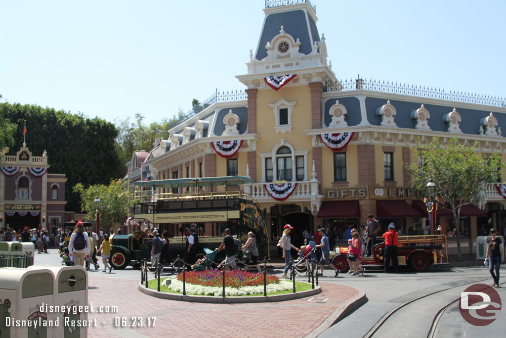 A traffic jam on Main Street too as a car, omnibus and firetruck all wait to head backstage.