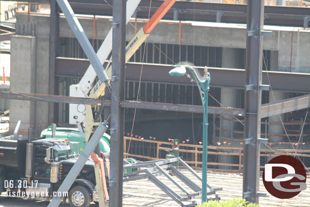 Wall structures in the curved area and more steel waiting to be moved into place in the large open area now.