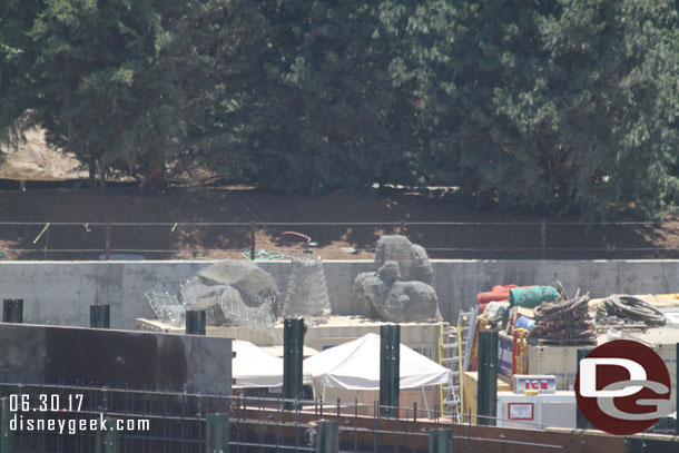 Some wire mesh rock structures waiting to be installed.