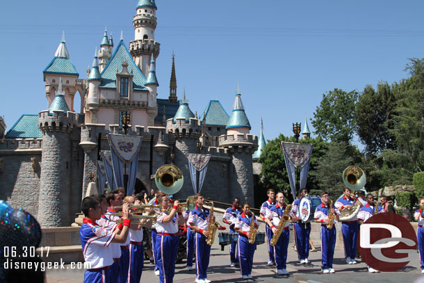 The All-American College Band performing in front of Sleeping Beauty Castle.