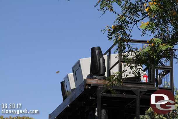 Raising the center light tower for Fantasmic.  Note the large projectors and automated spotlights now on the top.