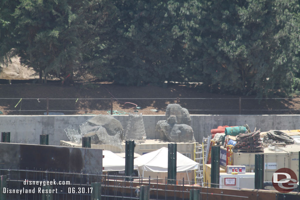 Some wire mesh rock structures waiting to be installed.