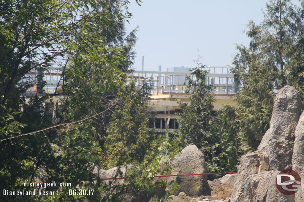 The Star Wars buildings through the trees.