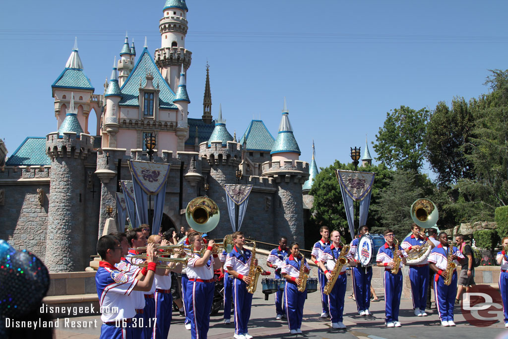 The All-American College Band performing in front of Sleeping Beauty Castle.