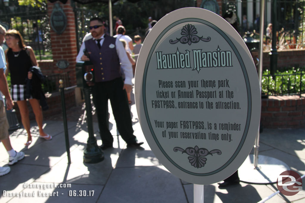 Signs up at each FastPass attraction with the new process.