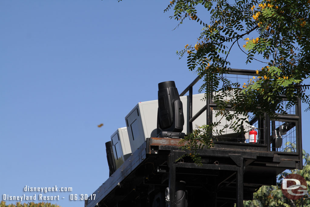 Raising the center light tower for Fantasmic.  Note the large projectors and automated spotlights now on the top.