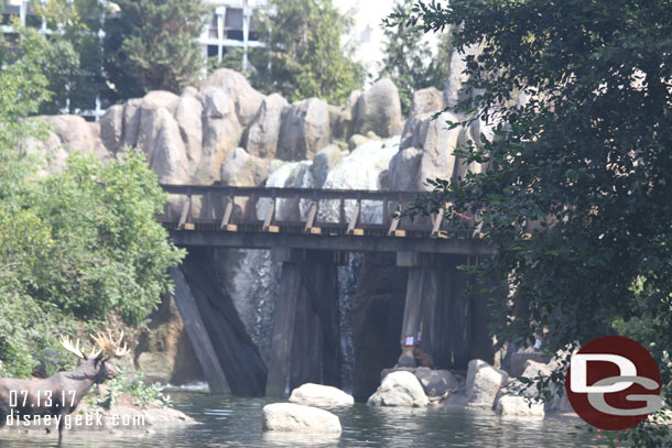 Water is flowing over the large waterfall.