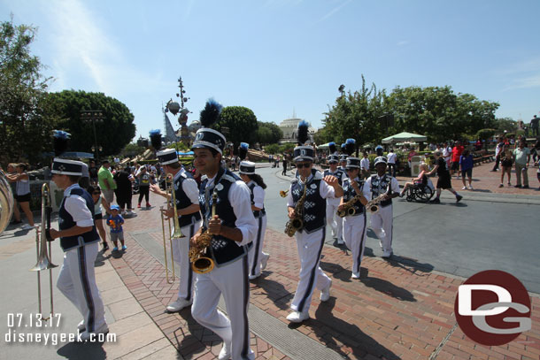 The Disneyland Band arriving for a performance in front of Sleeping Beauty Castle.