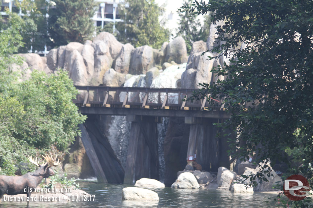 Water is flowing over the large waterfall.