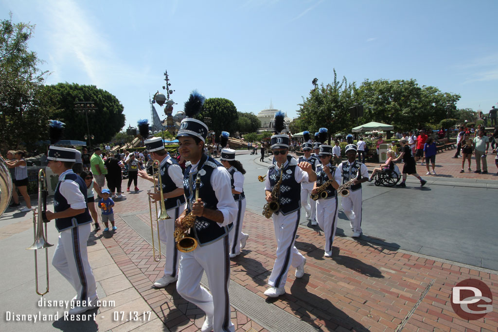 The Disneyland Band arriving for a performance in front of Sleeping Beauty Castle.