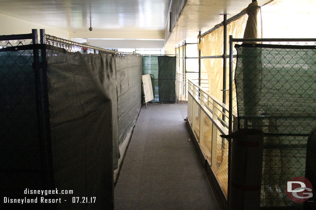 It appears they are redoing the walkways by the escalators.  The colored tiles are being removed.