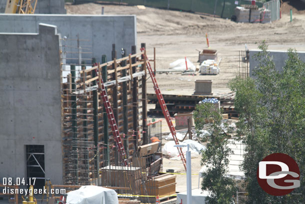 Looks like they are starting to put in rebar to join the wall on the concrete building to the perimeter wall.