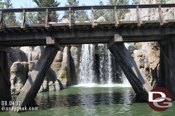 Behind the waterfall is where the Fantasmic marina is.